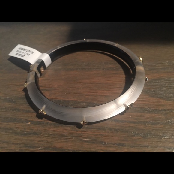 Alexis Bittar clear studded Lucite bracelet with gold studs